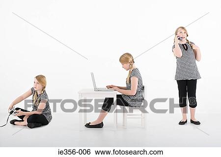 Stock Photograph - Girl with gadgets. Fotosearch