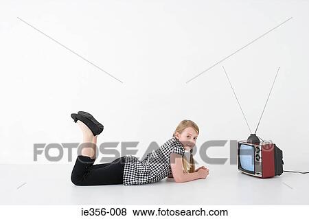 Stock Photo - Girl with television. Fotosearch