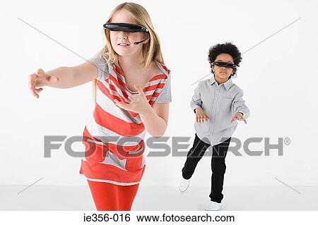 Kids wearing virtual reality headsets View Large Photo Image Stock Photograph - Kids wearing virtual reality headsets. Fotosearch