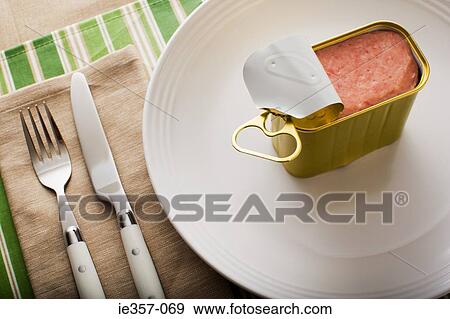 A can of ham on a plate View Large Photo Image Stock Photo - A can of ham on a plate. Fotosearch