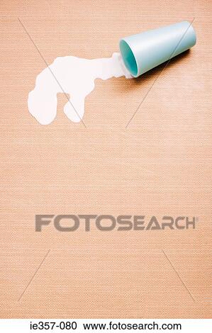A spilt cup of milk View Large Photo Image Stock Image - A spilt cup of milk. Fotosearch