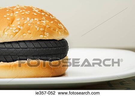 A tyre in a burger View Large Photo Image Stock Image - A tyre in a burger. Fotosearch