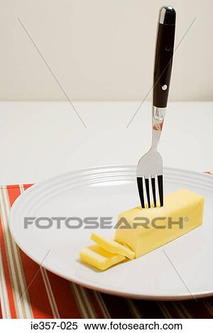 Block of butter on a plate View Large Photo Image Stock Photography - Block of butter on a plate. Fotosearch