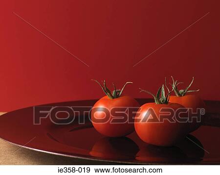 Tomatoes on plate View Large Photo Image Stock Photo - Tomatoes on plate. Fotosearch