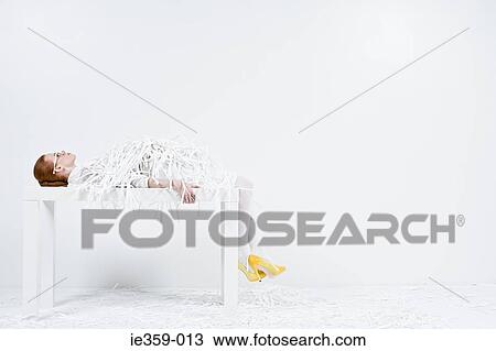 A businesswoman covered in shredded paper View Large Photo Image Stock Image - A businesswoman covered in shredded paper. Fotosearch