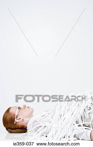 A businesswoman covered in shredded paper View Large Photo Image Stock Photo - A businesswoman covered in shredded paper. Fotosearch