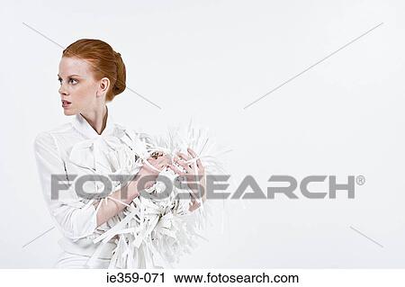 A businesswoman holding shredded paper View Large Photo Image Stock Image - A businesswoman holding shredded paper. Fotosearch