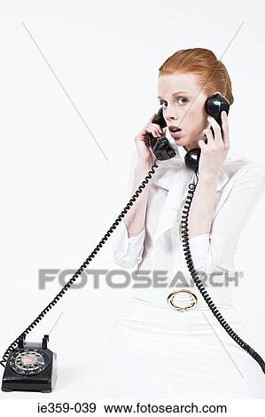 A businesswoman multitasking View Large Photo Image Stock Photo - A businesswoman multitasking. Fotosearch