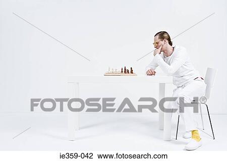 A man playing chess View Large Photo Image Stock Image - A man playing chess. Fotosearch