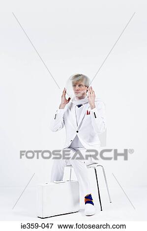 A man wearing a goldfish bowl View Large Photo Image Stock Photo - A man wearing a goldfish bowl. Fotosearch