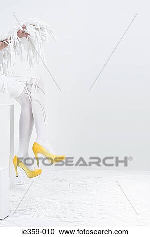 A woman holding shredded paper View Large Photo Image Stock Image - A woman holding shredded paper. Fotosearch