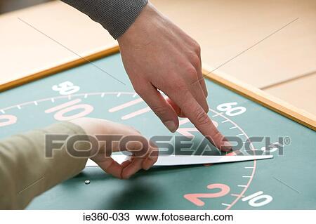 Child and teacher with clock View Large Photo Image Stock Image - Child and teacher with clock. Fotosearch