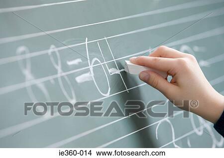 Child writing on blackboard View Large Photo Image Picture - Child writing on blackboard. Fotosearch
