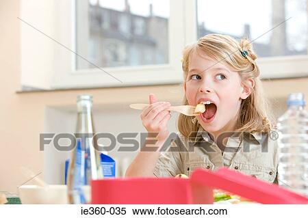 Girl having lunch View Large Photo Image Stock Photography - Girl having lunch. Fotosearch