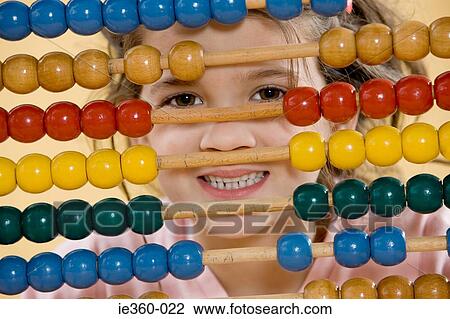 Girl with an abacus View Large Photo Image Stock Image - Girl with an abacus. Fotosearch