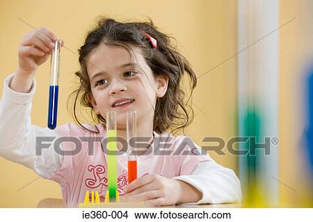 Girl with test tubes View Large Photo Image Picture - Girl with test tubes. Fotosearch