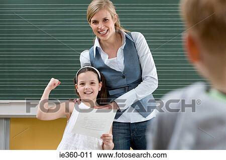 Teacher and girl in class View Large Photo Image Stock Image - Teacher and girl in class. Fotosearch