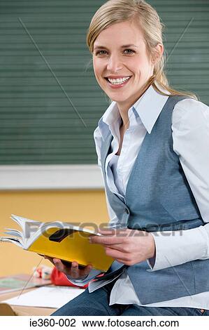 Teacher with textbook View Large Photo Image Stock Image - Teacher with textbook. Fotosearch
