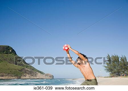 A teenage boy catching a football View Large Photo Image Stock Photo - A teenage boy catching a football. Fotosearch