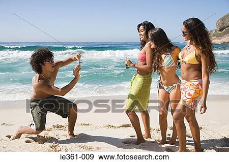 A teenage boy photographing teenage girls View Large Photo Image Stock Photo - A teenage boy photographing teenage girls. Fotosearch