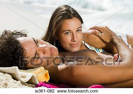 A teenage couple on the beach View Large Photo Image Stock Image - A teenage couple on the beach. Fotosearch