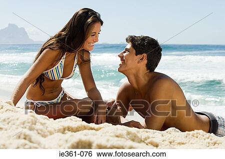 A teenage couple on the beach View Large Photo Image Stock Photograph - A teenage couple on the beach. Fotosearch