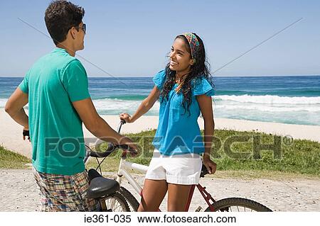 A teenage couple with bikes View Large Photo Image Stock Photography - A teenage couple with bikes. Fotosearch