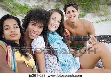 Portrait of teenagers on a beach View Large Photo Image Stock Image - Portrait of teenagers on a beach. Fotosearch