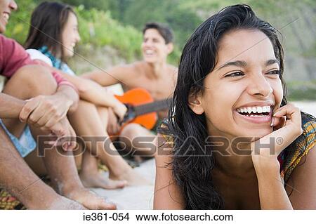 Picture - Teenagers on the beach. Fotosearch