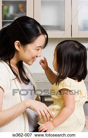 Stock Photo - A mother and daughter. Fotosearch