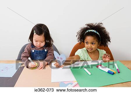 Girls drawing View Large Photo Image Stock Image - Girls drawing. Fotosearch