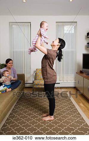 Stock Image - Mothers with their babies. Fotosearch