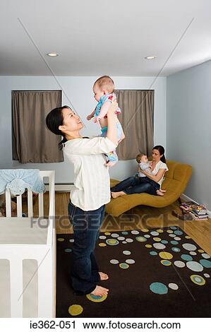 Stock Image - Mothers with their babies. Fotosearch