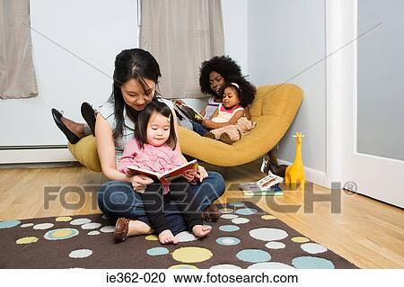 Stock Image - Mothers with their daughters. Fotosearch