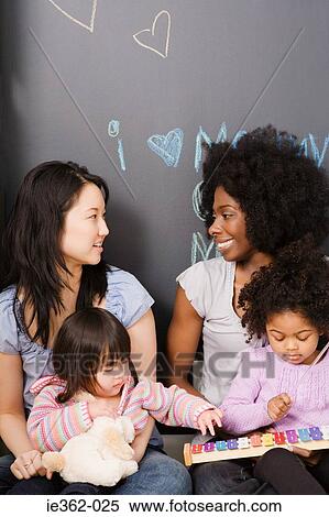 Stock Photography - Mothers with their daughters. Fotosearch