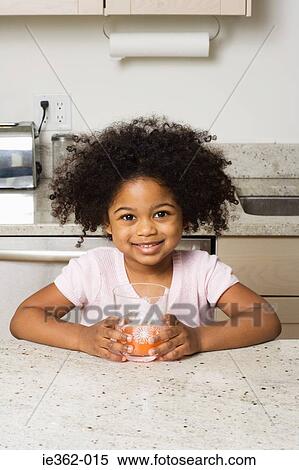 Portrait of a girl holding a glass View Large Photo Image Stock Photography - Portrait of a girl holding a glass. Fotosearch