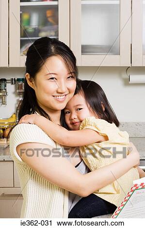 Stock Image - Portrait of a mother and daughter. Fotosearch