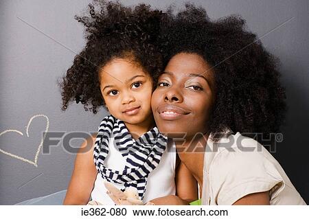 Stock Image - Portrait of a mother and daughter. Fotosearch