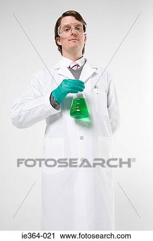 Stock Image - Scientist holding flask. Fotosearch