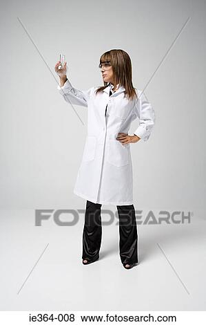 Scientist holding flask View Large Photo Image Stock Photo - Scientist holding flask. Fotosearch