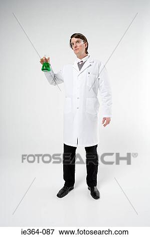 Stock Photo - Scientist holding flask. Fotosearch