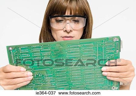 Scientist with circuit board View Large Photo Image Stock Photo - Scientist with circuit board. Fotosearch