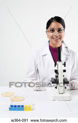 Scientist with microscope View Large Photo Image Stock Image - Scientist with microscope. Fotosearch
