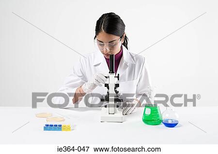 Scientist with microscope View Large Photo Image Stock Photo - Scientist with microscope. Fotosearch