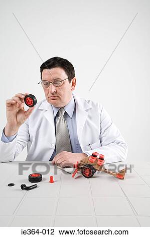 Scientist with model helicopter View Large Photo Image Stock Image - Scientist with model helicopter. Fotosearch