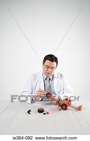 Scientist with model helicopter View Large Photo Image Stock Image - Scientist with model helicopter. Fotosearch