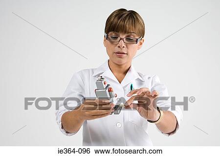 Scientist with robot View Large Photo Image Stock Photograph - Scientist with robot. Fotosearch