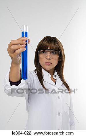 Stock Image - Scientist with test tube. Fotosearch