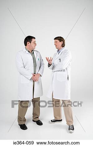 Scientists having discussion View Large Photo Image Stock Photo - Scientists having discussion. Fotosearch