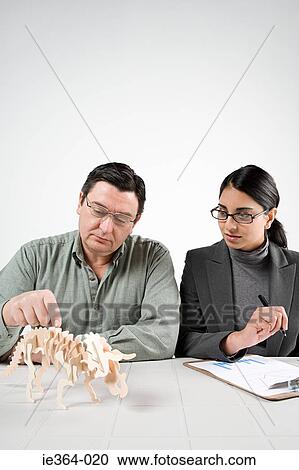 Scientists with model dinosaur View Large Photo Image Stock Image - Scientists with model dinosaur. Fotosearch